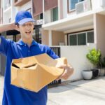Delivery Man with Damaged Parcel Box Delivered to Customer