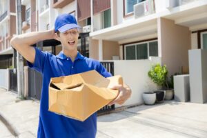 Delivery Man with Damaged Parcel Box Delivered to Customer